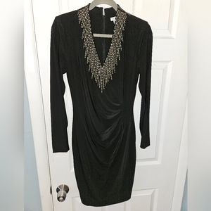 Cache- Black dress with gold detail and cold shoulder long sleeve